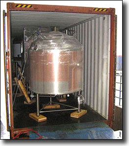 shrink wrap & loading industrial items onto a shipping container